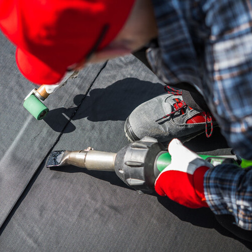 man providing installation of an EPDM membrane rubber roof