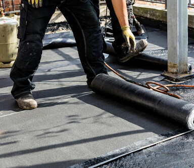 Modified Bitumen with man providing installation
