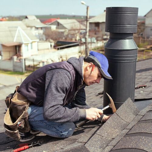 Man repairing a roof