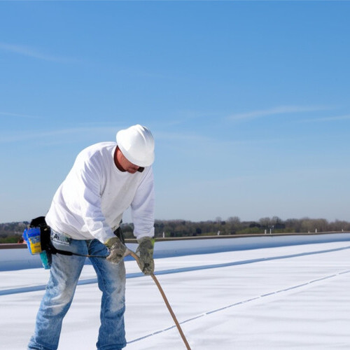 silicone roof coating being applied to commercial roof